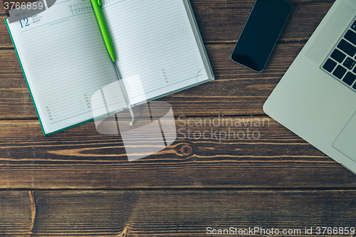 Image of Laptop and diary on the desk