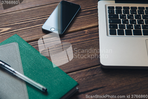 Image of Laptop and diary on the desk