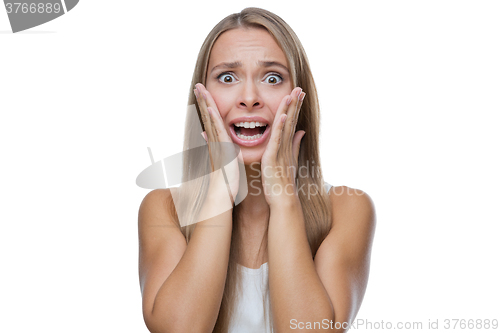 Image of Portrait of surprised woman on white background