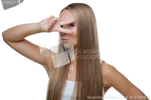 Image of Beautiful woman shows gesture v