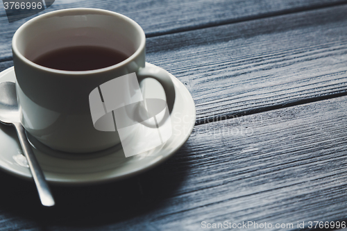 Image of Cup of tea on Wooden Table