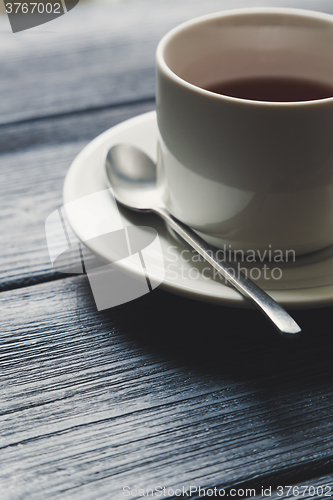 Image of Cup of tea on Wooden Table