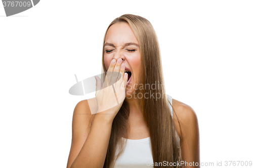 Image of Woman yawns of boredom on white background