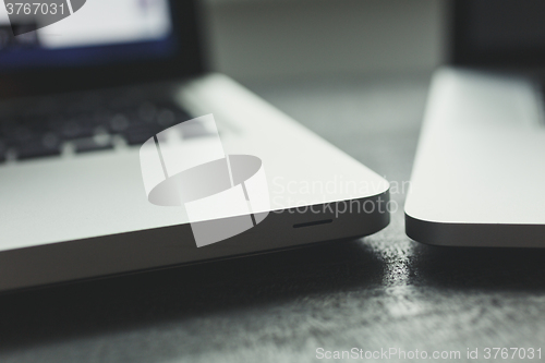 Image of Two laptops on modern wooden desk 