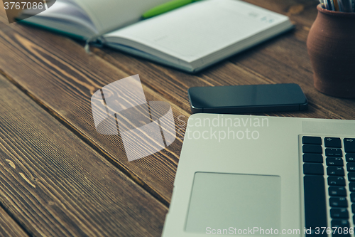 Image of Laptop and diary on the desk