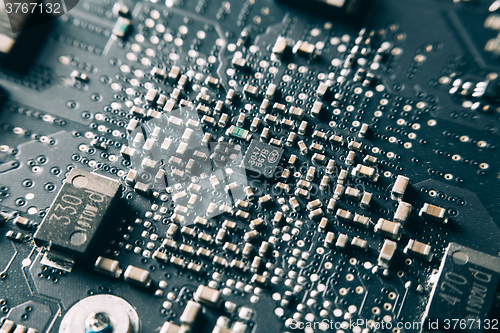 Image of Printed Circuit Board with electrical components.