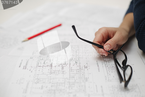 Image of Architect sketching a construction project