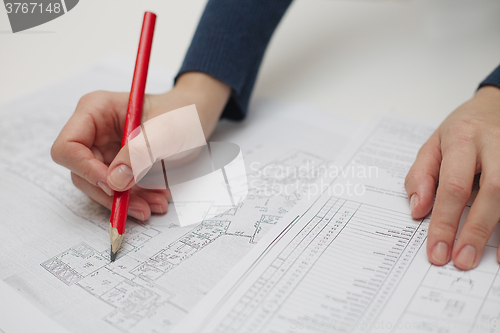 Image of Architect sketching a construction project