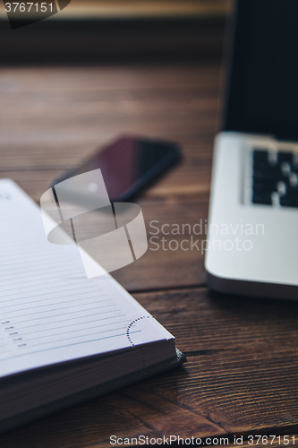 Image of Laptop and diary on the desk