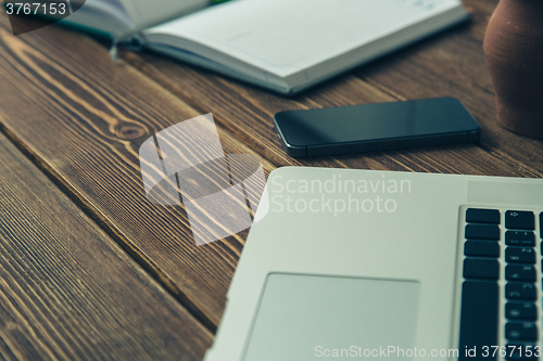 Image of Laptop and diary on the desk