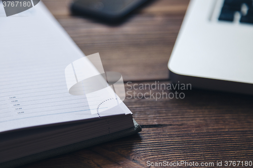 Image of Laptop and diary on the desk