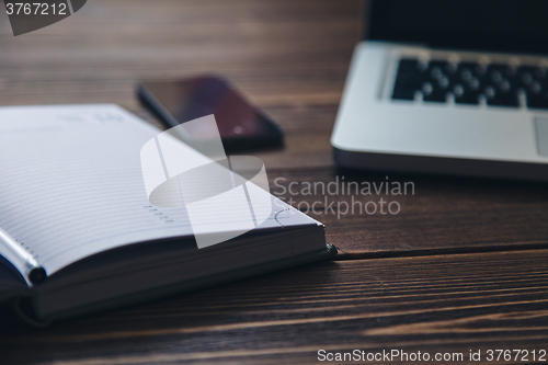 Image of Laptop and diary on the desk