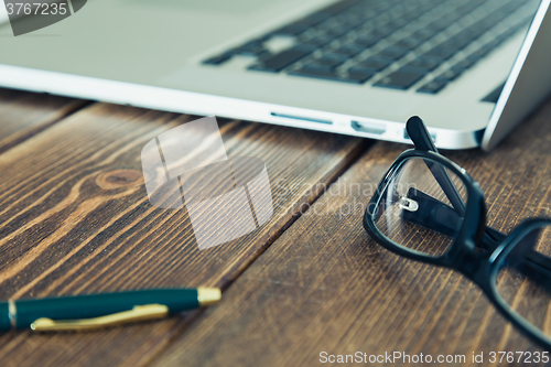 Image of Laptop and diary on the desk