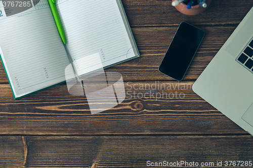 Image of Laptop and diary on the desk