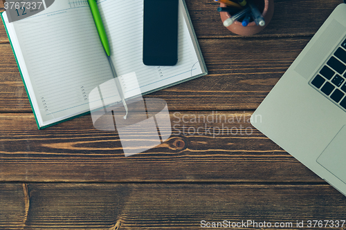 Image of Laptop and diary on the desk