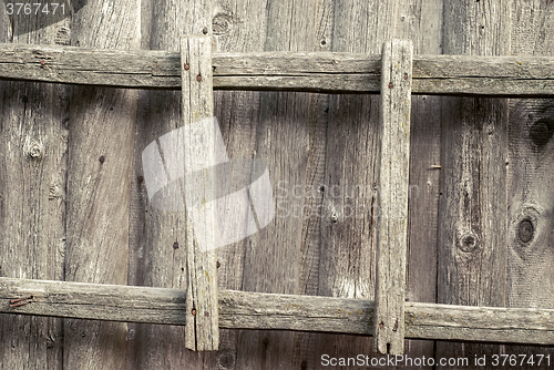 Image of wooden ladder on the wall