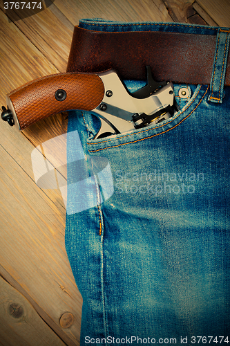 Image of revolver in the pocket