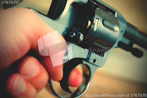 Image of hand with gun