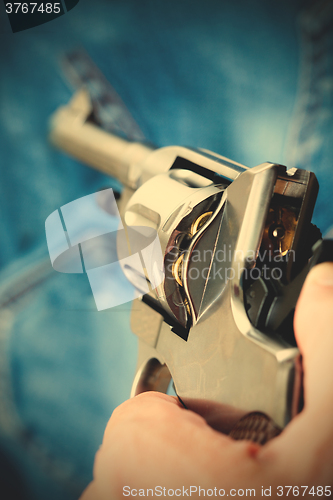 Image of pistol in hand, close-up