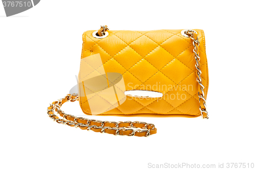 Image of Yellow womens bag isolated on white background.