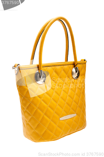 Image of Yellow womens bag isolated on white background.
