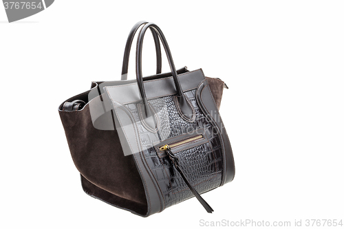 Image of Dark chocolate leather womens bag isolated on white background.