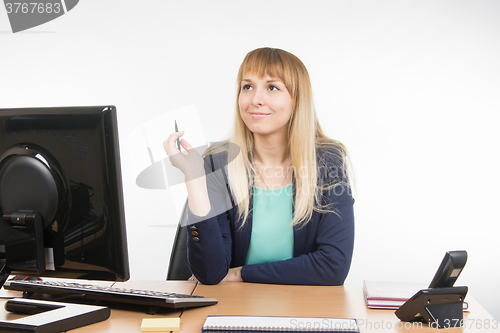 Image of Secretary girl thought sitting at her workplace in the office