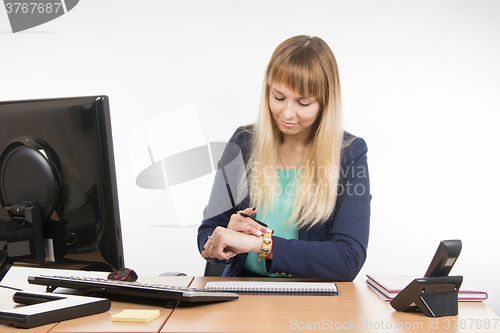 Image of Business woman looked at his watch waiting for the client in the office