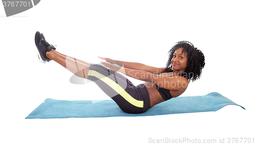 Image of Pretty African American girl exercising.