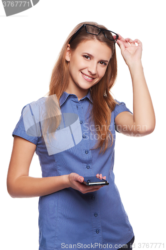 Image of Laughing woman holding cell phone