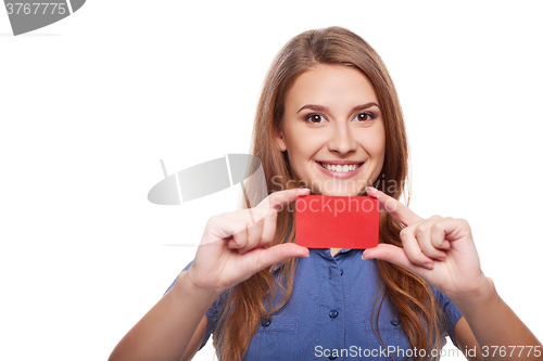 Image of Confident business woman in glasses showing blank credit card