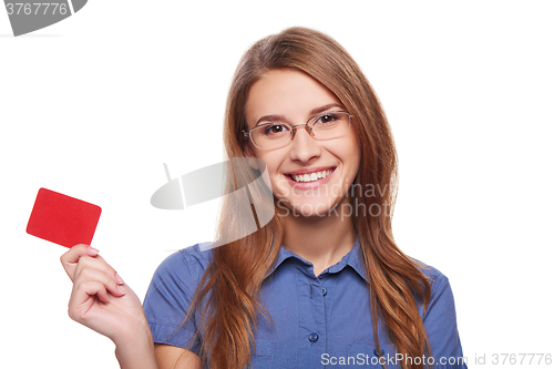 Image of Confident business woman in glasses showing blank credit card