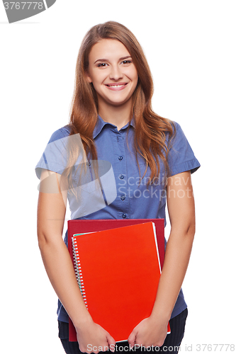 Image of Young woman holding textbooks