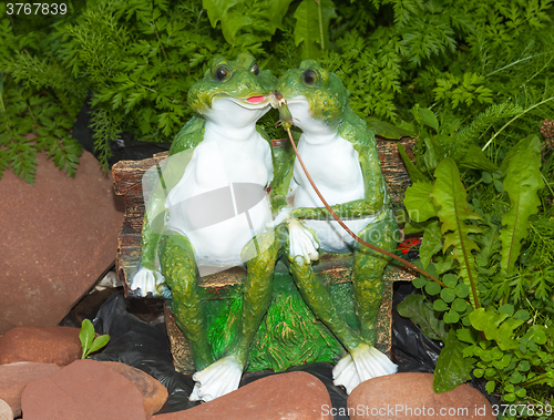 Image of Two green ornament frog