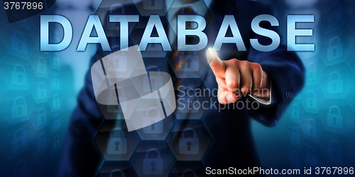Image of Manager Touching DATABASE Onscreen
