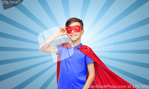 Image of boy in red super hero cape and mask