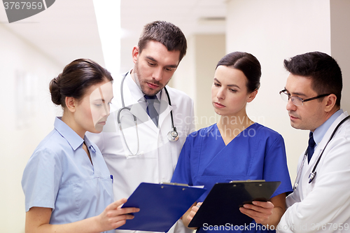 Image of group of medics at hospital with clipboard