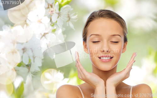 Image of smiling young woman face and hands