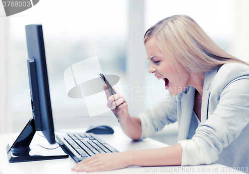 Image of angry woman with phone