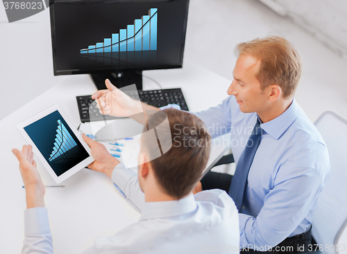 Image of businessmen with tablet pc and computer at office