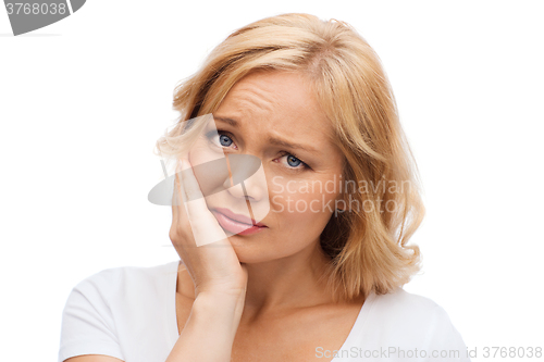 Image of unhappy woman suffering toothache