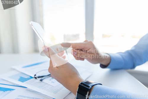 Image of close up of woman with transparent smartphone