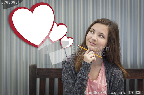 Image of Daydreaming Girl With Blank Floating Hearts - Clipping Path