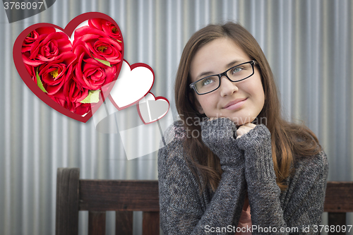 Image of Daydreaming Girl Next To Floating Hearts with Red Roses