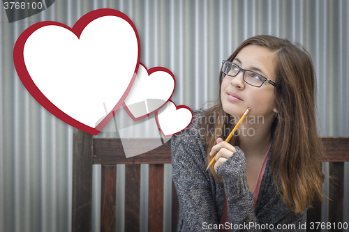 Image of Daydreaming Girl With Blank Floating Hearts - Clipping Path