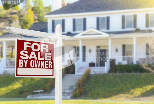 Image of For Sale By Owner Real Estate Sign and House