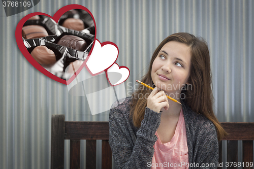 Image of Daydreaming Girl Next To Floating Hearts with Chocolates