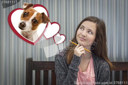 Image of Daydreaming Girl Next To Floating Hearts with Puppy Within