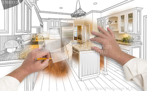 Image of Male Hands Sketching Custom Kitchen with Photo Showing Through