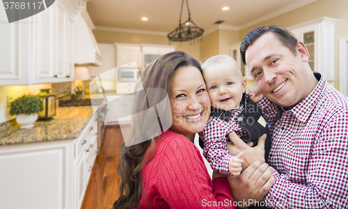 Image of Young Family Inside Beautiful Custom Kitchen